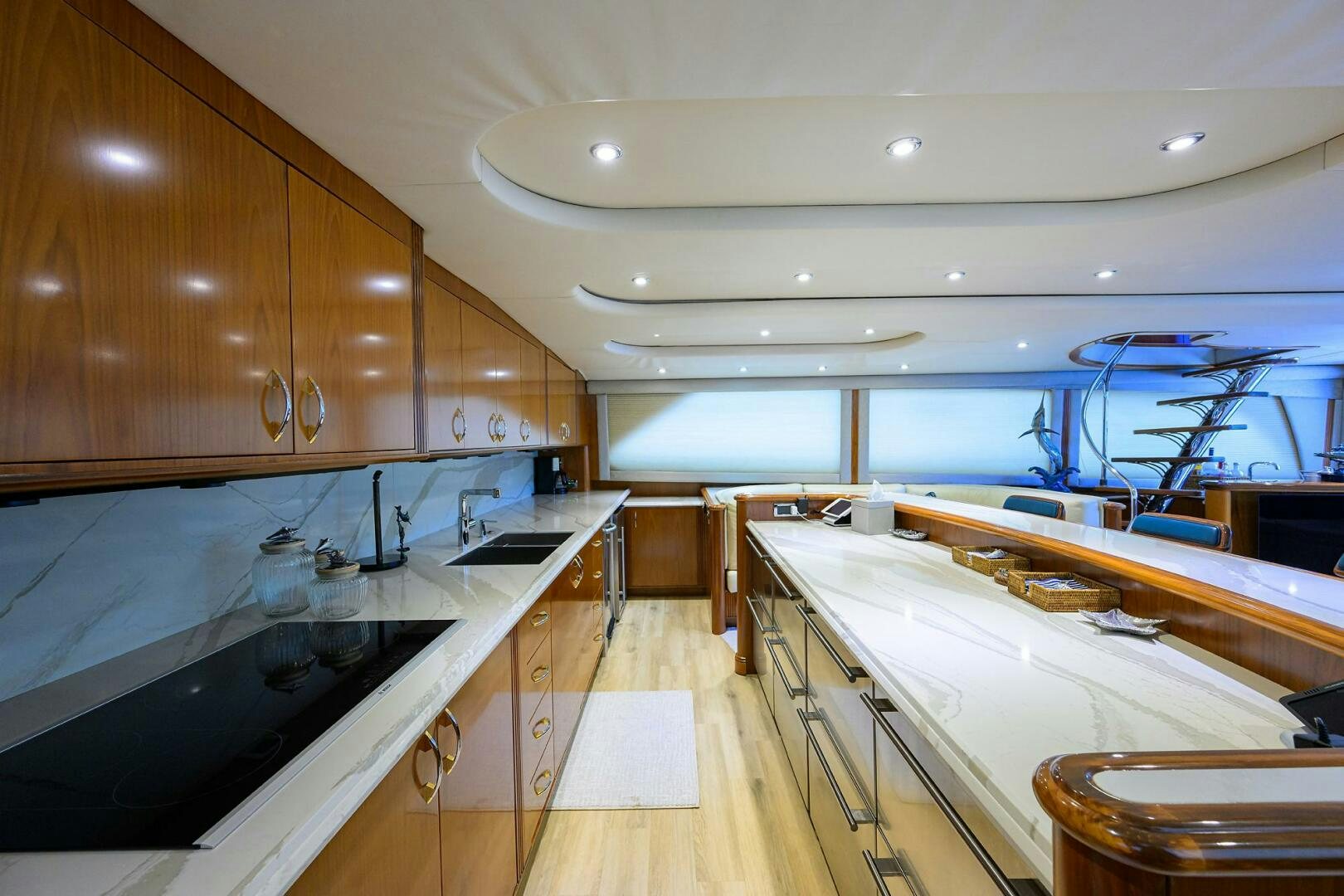 a kitchen with wooden cabinets aboard JR Yacht for Sale
