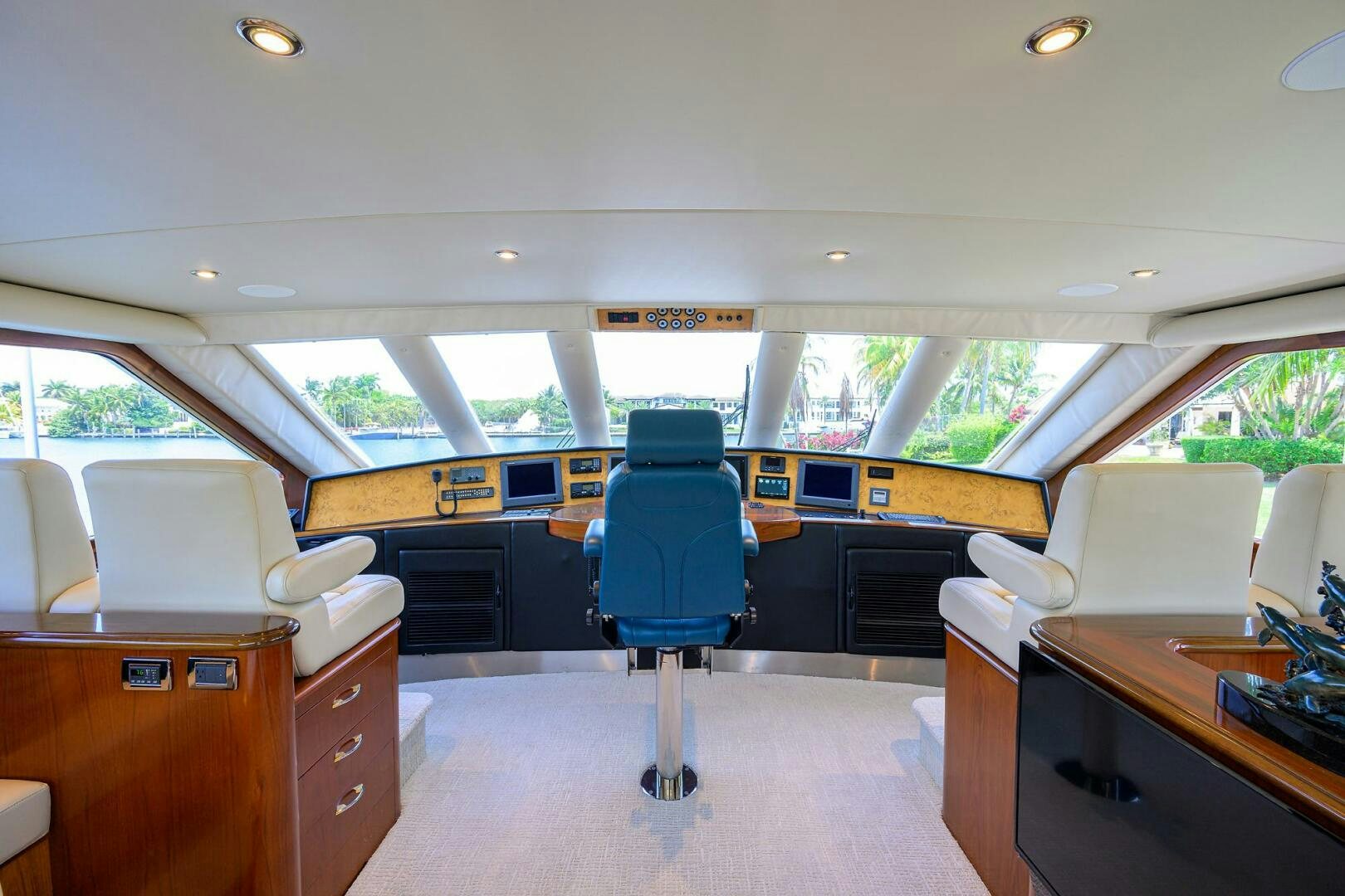 a room with a desk and chairs aboard JR Yacht for Sale