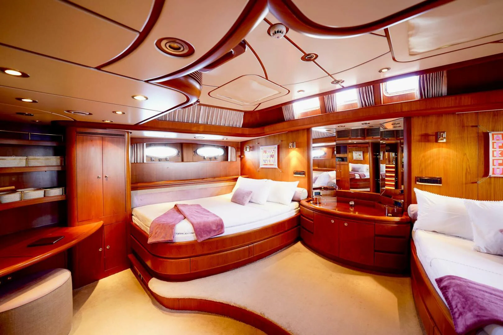 a room with a bed and a desk aboard IKARON Yacht for Sale
