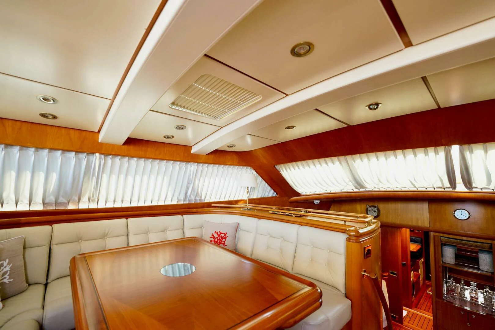 a room with a table and chairs aboard IKARON Yacht for Sale