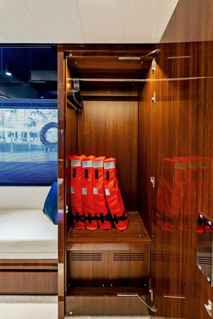 a closet with a pair of red boots on it aboard KNOT NORMAL Yacht for Sale