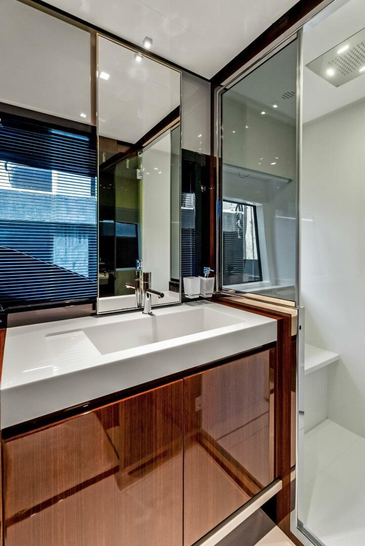 a bathroom with a large mirror aboard KNOT NORMAL Yacht for Sale