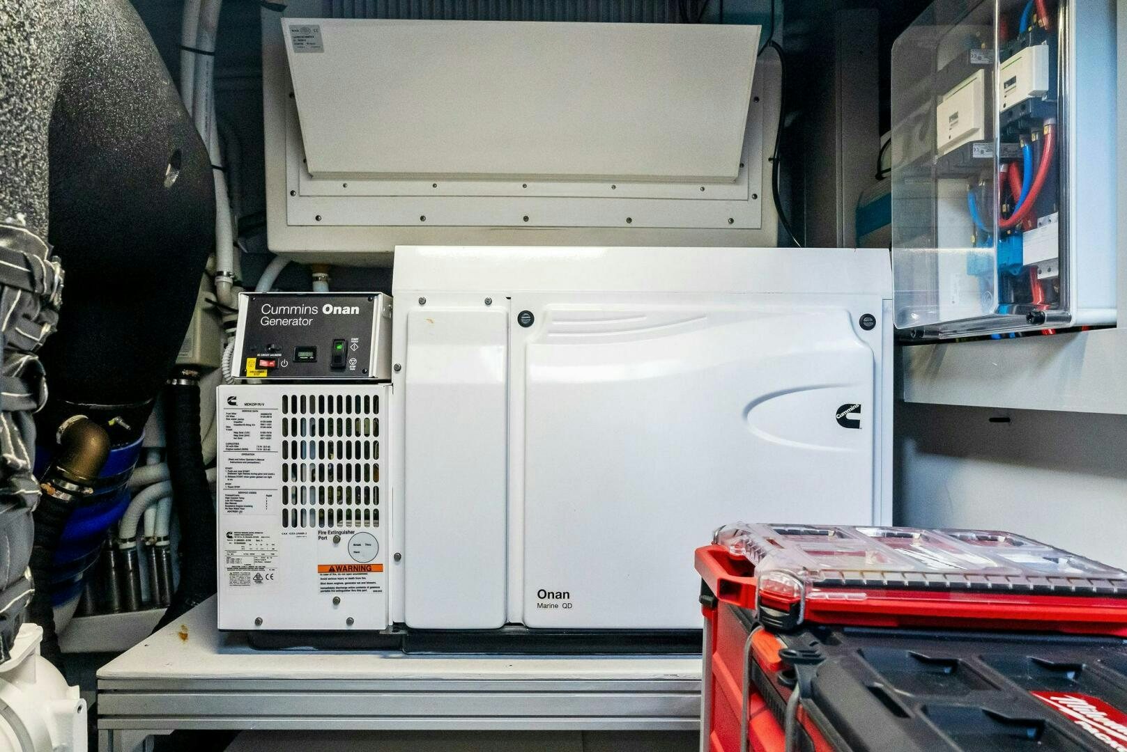 a white machine with a red and black object on it aboard KNOT NORMAL Yacht for Sale