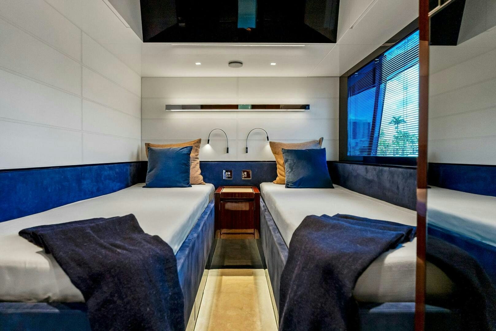 a room with beds and a window aboard KNOT NORMAL Yacht for Sale