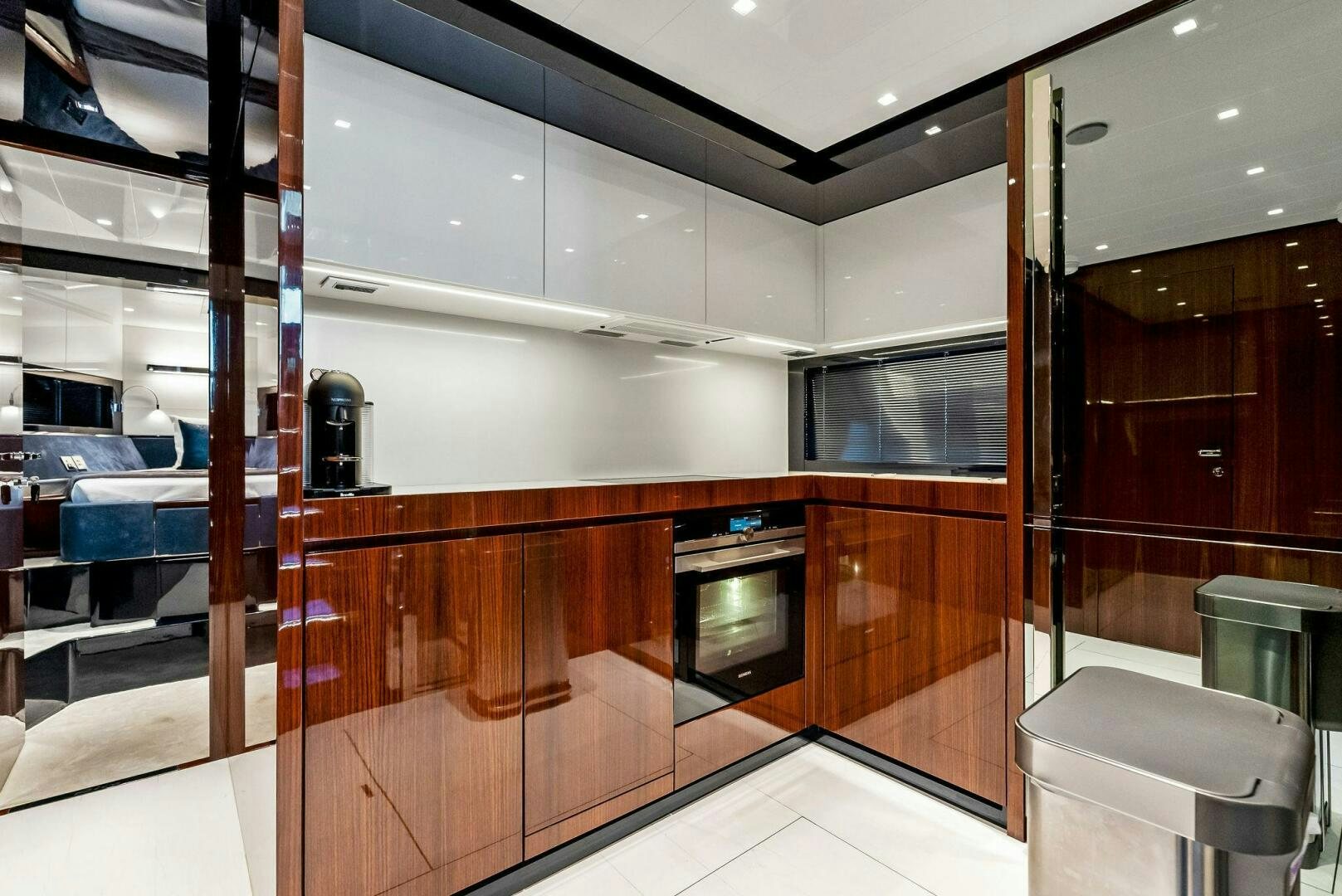 a kitchen with wooden cabinets aboard KNOT NORMAL Yacht for Sale