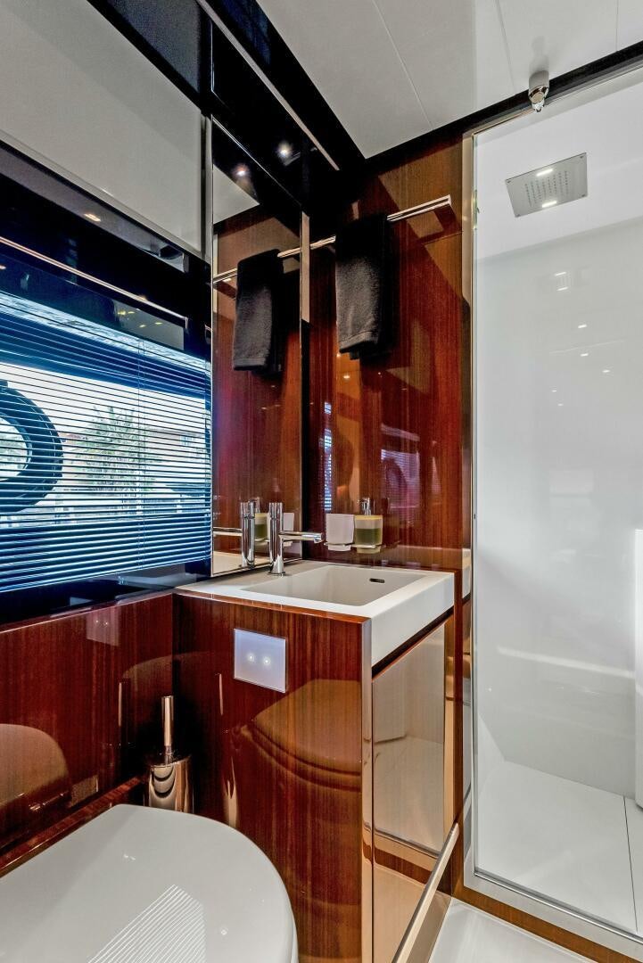 a bathroom with a sink and a bathtub aboard KNOT NORMAL Yacht for Sale