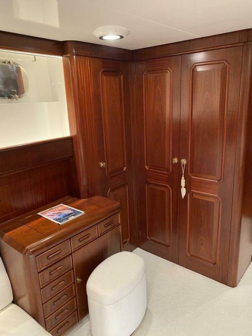 a wooden cabinet in a bathroom aboard PRECIOUS CARGO Yacht for Sale