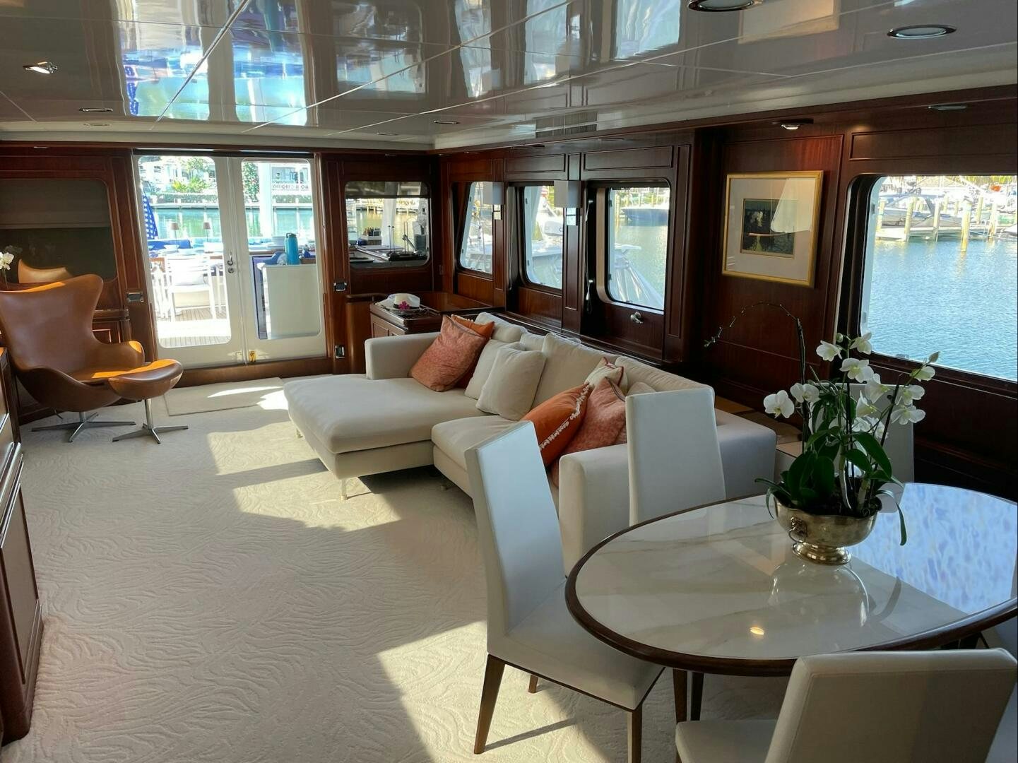 a living room with a large window aboard PRECIOUS CARGO Yacht for Sale