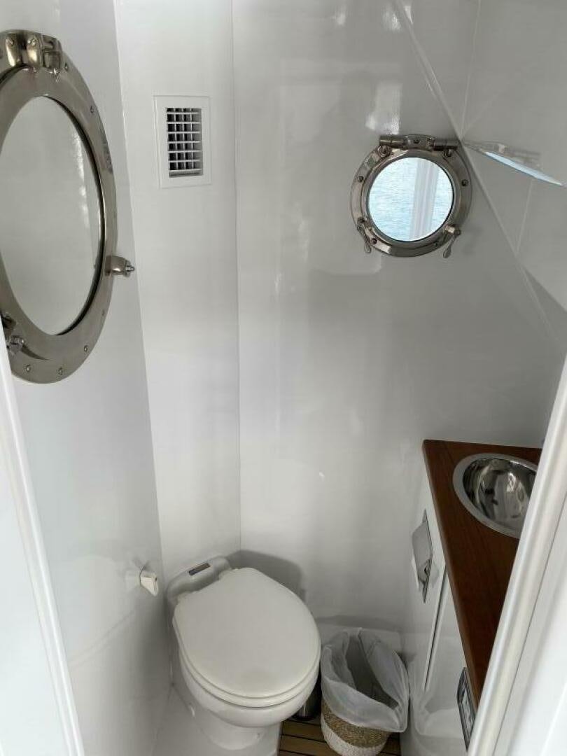 a small bathroom with a toilet aboard PRECIOUS CARGO Yacht for Sale