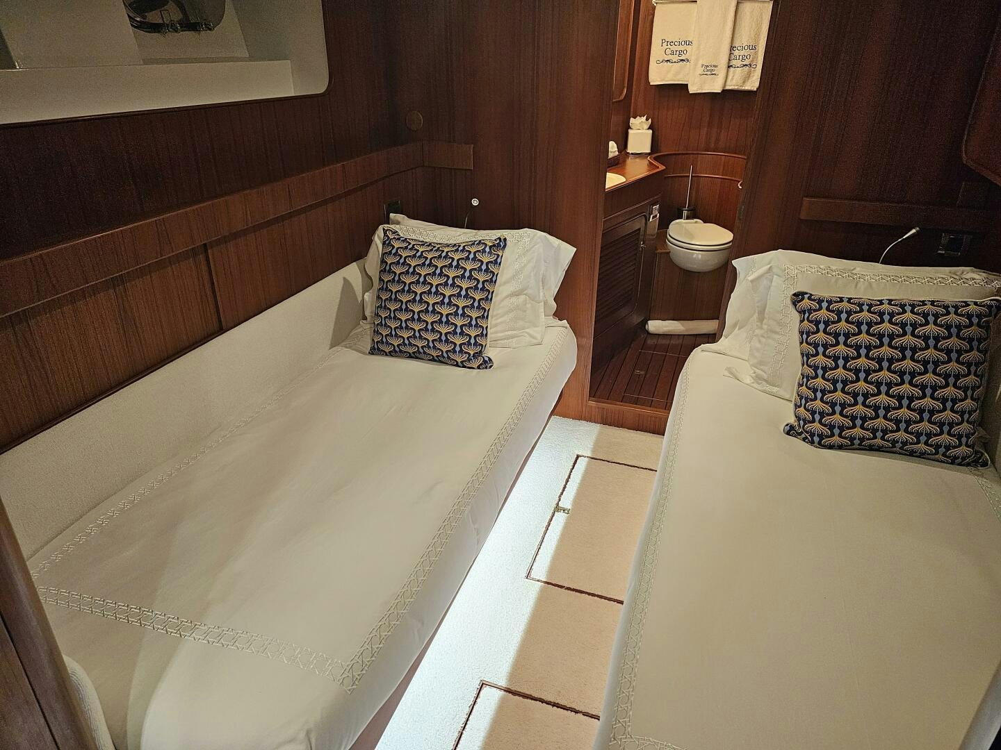 a room with two beds aboard PRECIOUS CARGO Yacht for Sale