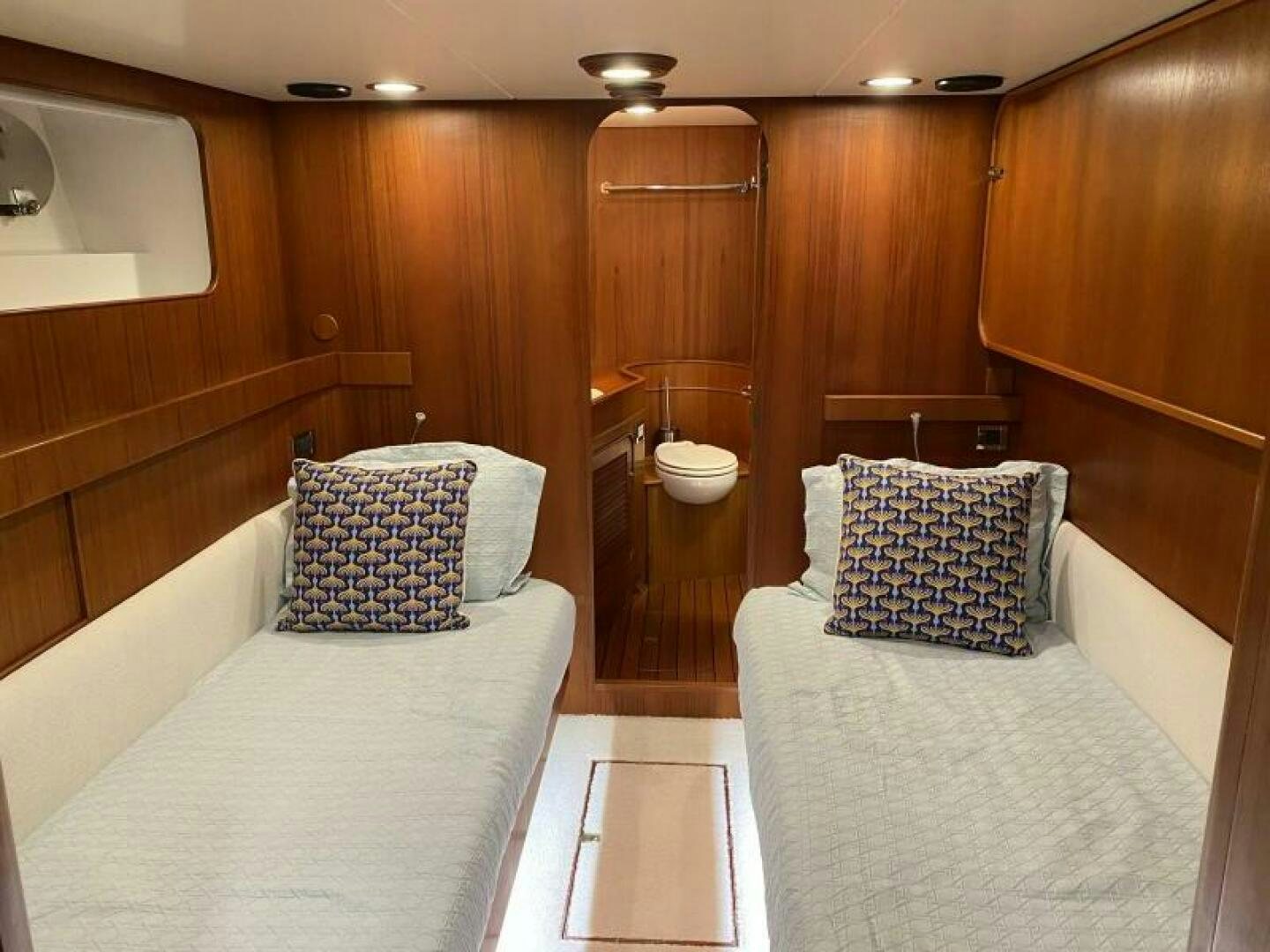 a room with a bed and a sink aboard PRECIOUS CARGO Yacht for Sale