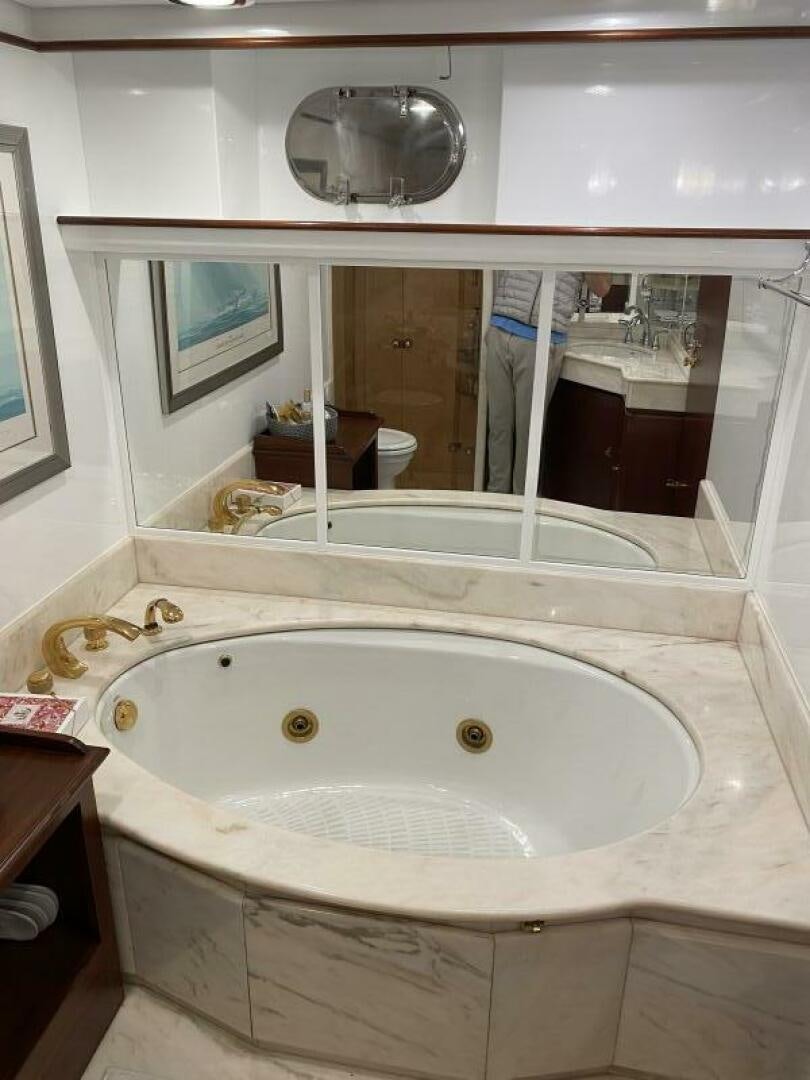 a bathroom with a large bathtub aboard PRECIOUS CARGO Yacht for Sale