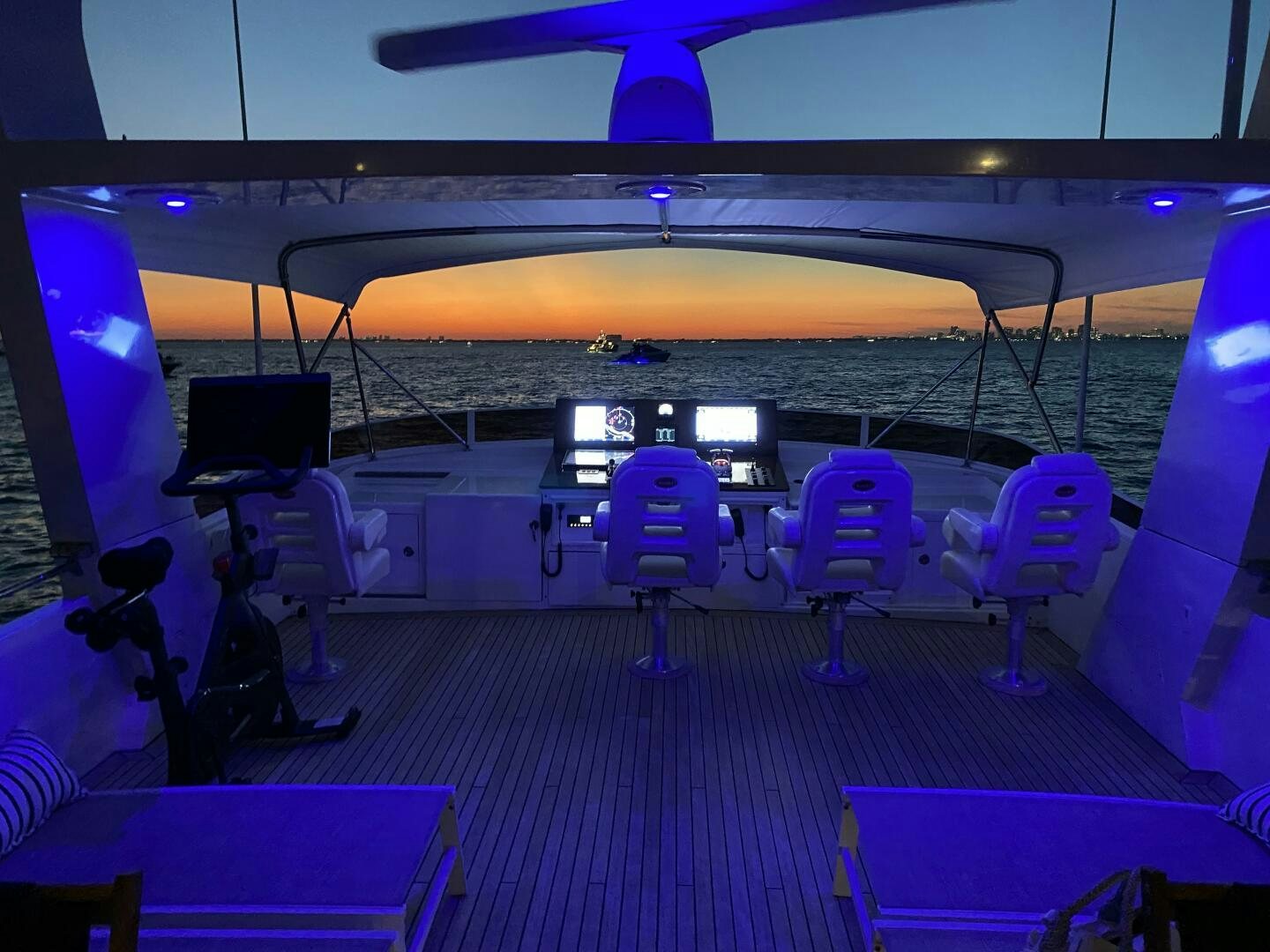 a gym with purple lighting aboard PRECIOUS CARGO Yacht for Sale
