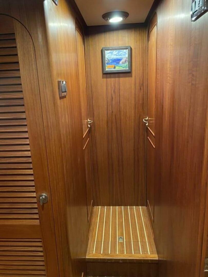 a wooden door with a picture on it aboard PRECIOUS CARGO Yacht for Sale