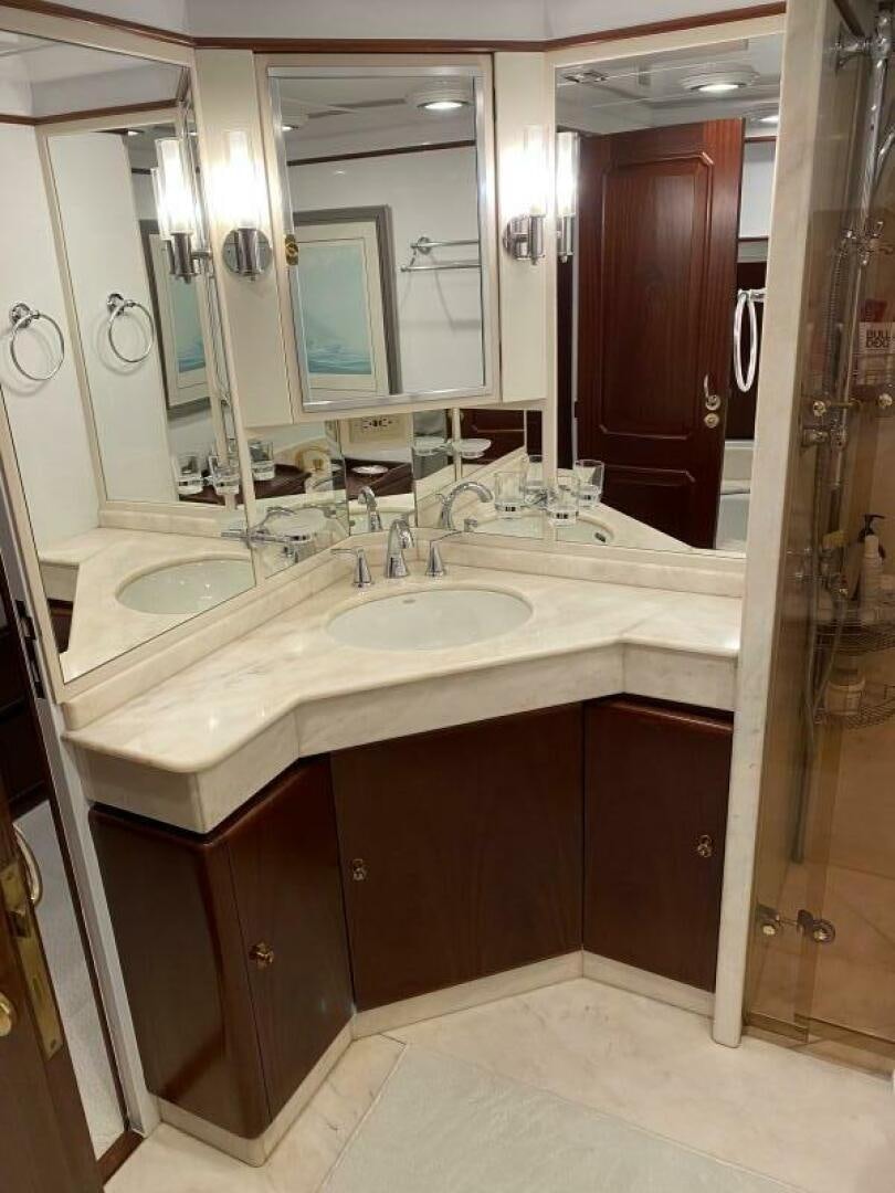 a bathroom with a sink and a mirror aboard PRECIOUS CARGO Yacht for Sale