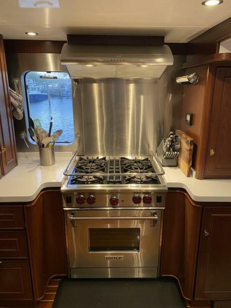 a stainless steel stove in a kitchen aboard PRECIOUS CARGO Yacht for Sale