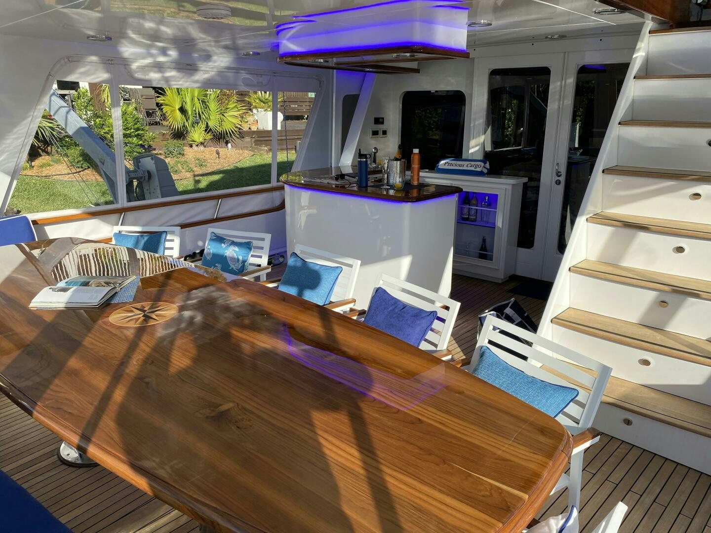 a room with a table and a window aboard PRECIOUS CARGO Yacht for Sale