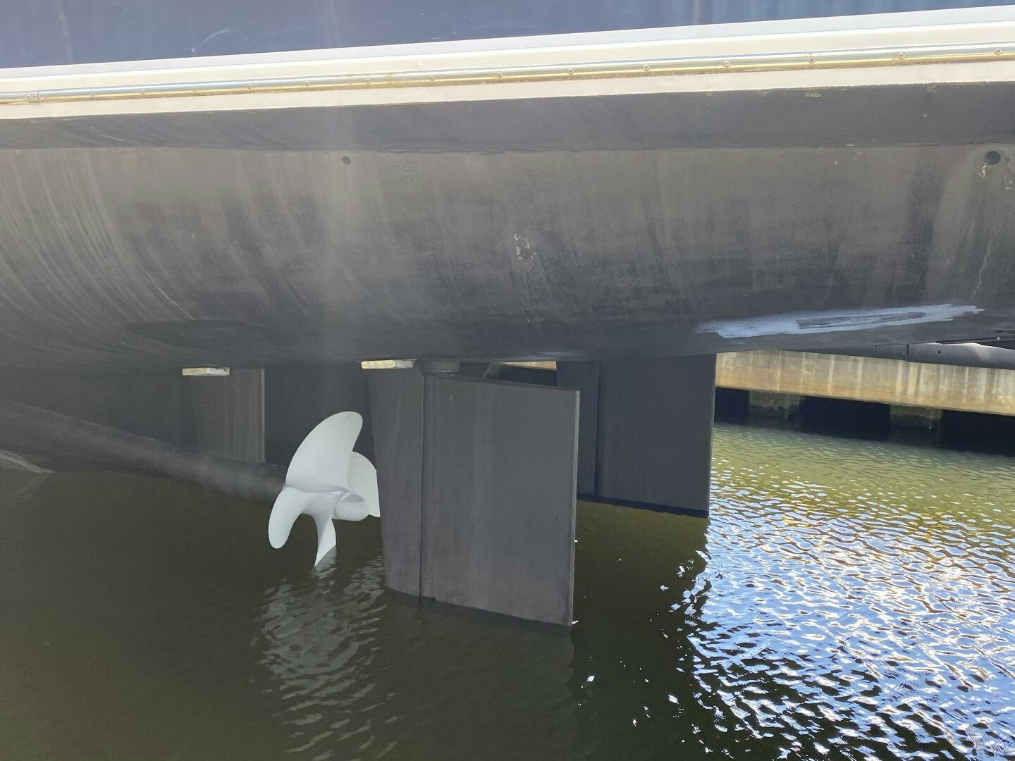 a white chair in a large room aboard PRECIOUS CARGO Yacht for Sale