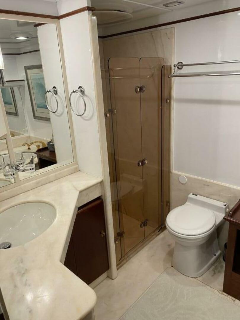 a bathroom with a shower and toilet aboard PRECIOUS CARGO Yacht for Sale