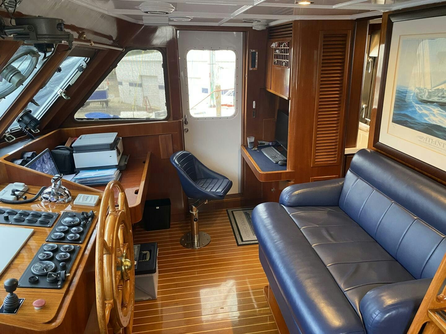 a living room with a wood floor aboard PRECIOUS CARGO Yacht for Sale