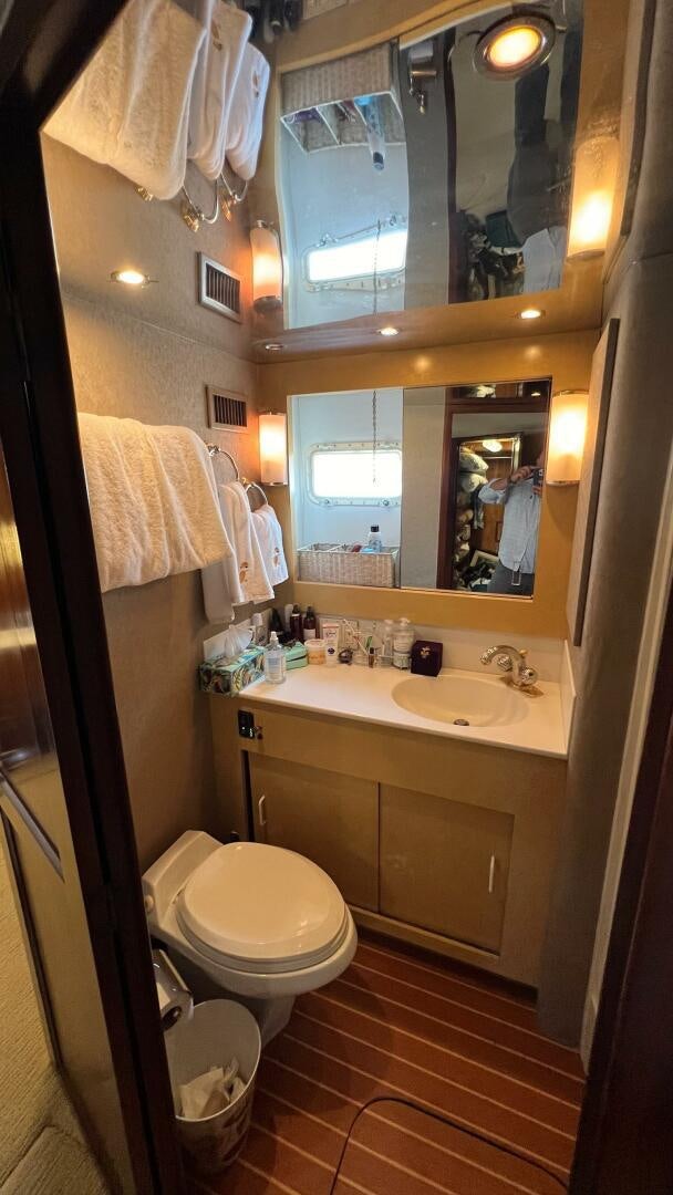 a bathroom with a sink and toilet aboard SEA OWL Yacht for Sale