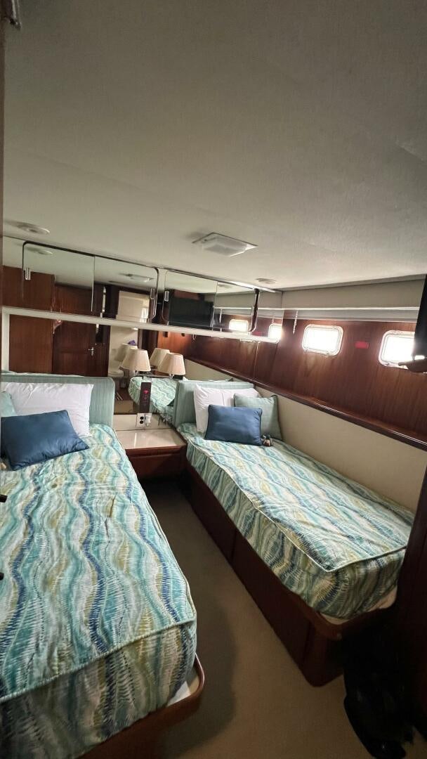 a couple of beds in a room aboard SEA OWL Yacht for Sale