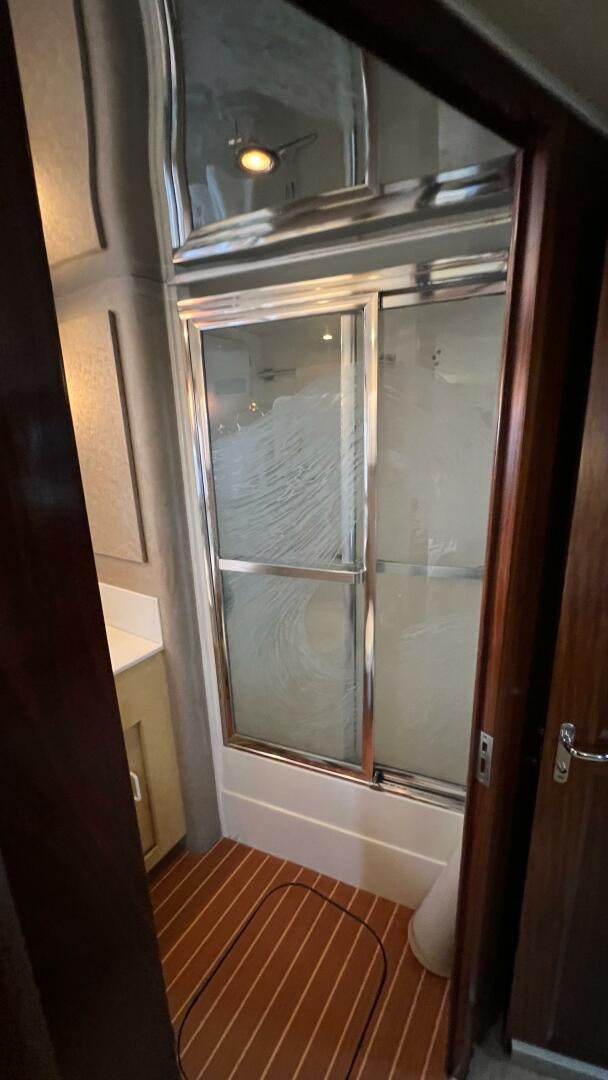 a glass door with a glass window aboard SEA OWL Yacht for Sale