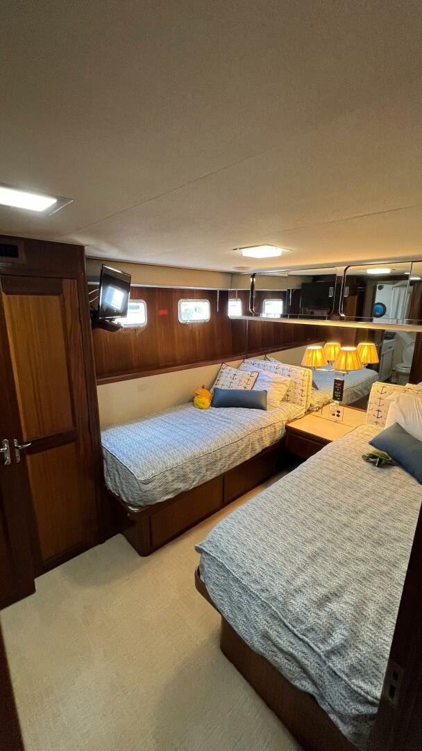 a room with two beds aboard SEA OWL Yacht for Sale