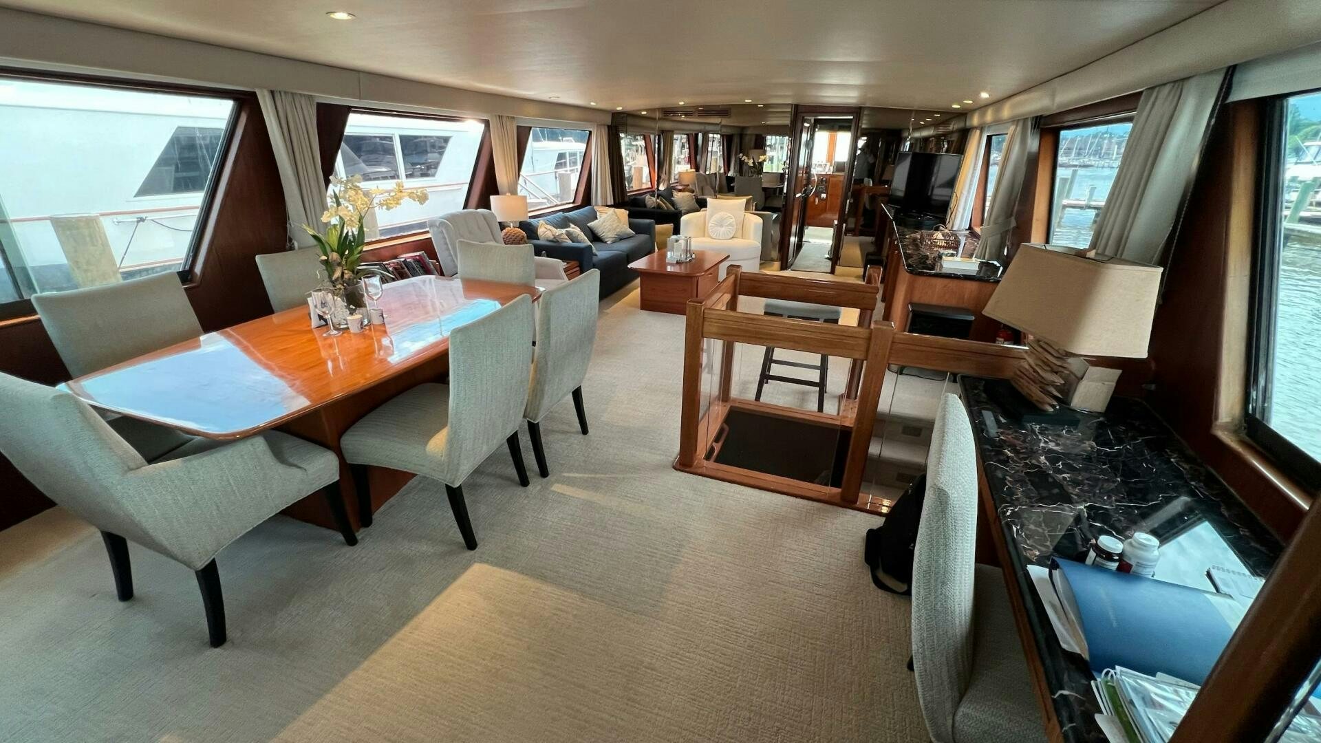 a room with a table chairs and a tv aboard SEA OWL Yacht for Sale
