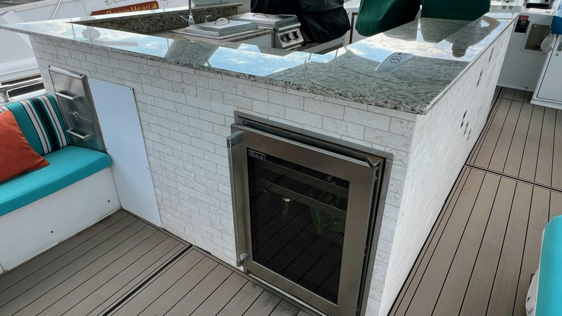 a patio with a fireplace aboard SEA OWL Yacht for Sale
