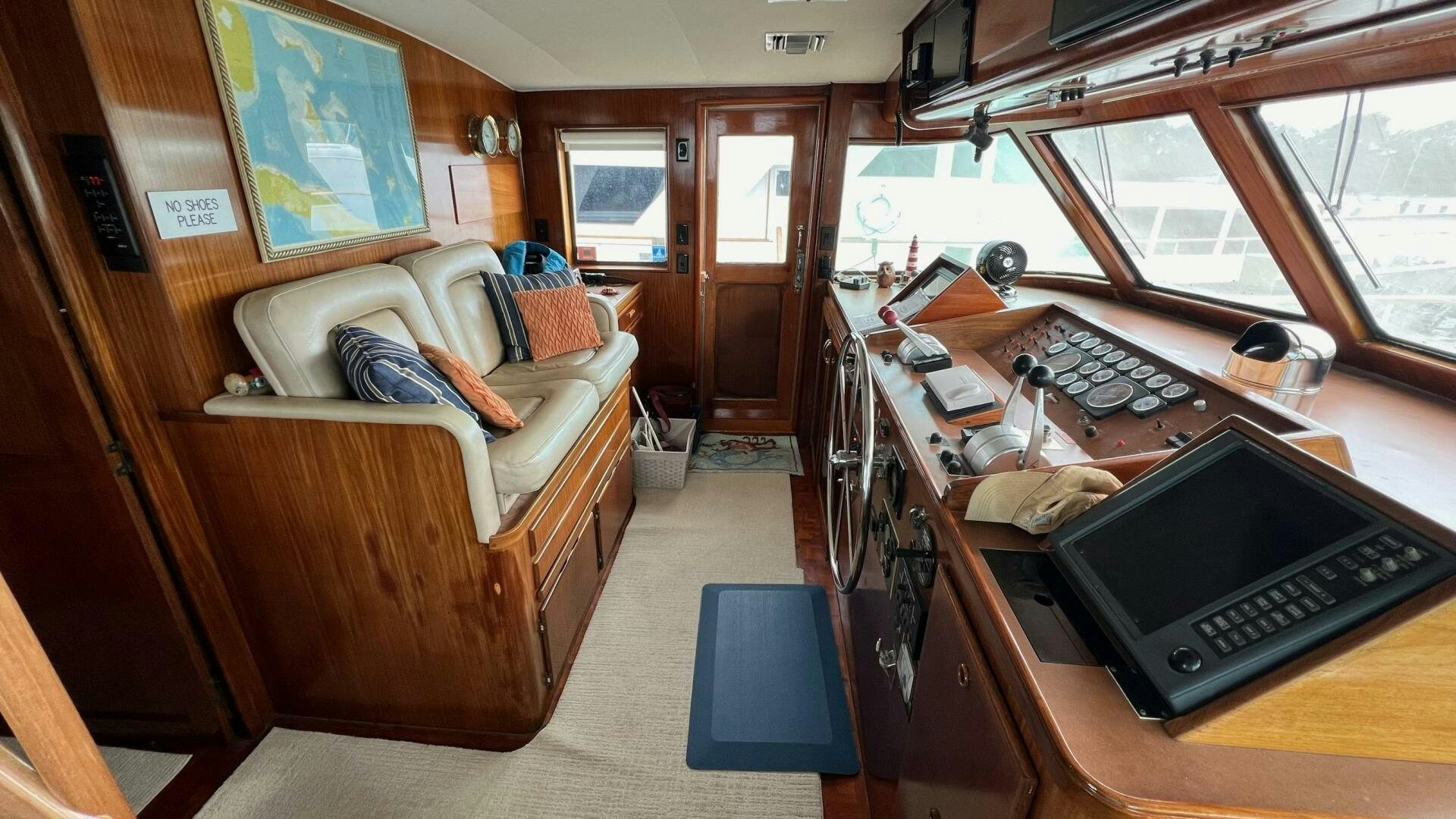 a living room with a bed and a desk aboard SEA OWL Yacht for Sale