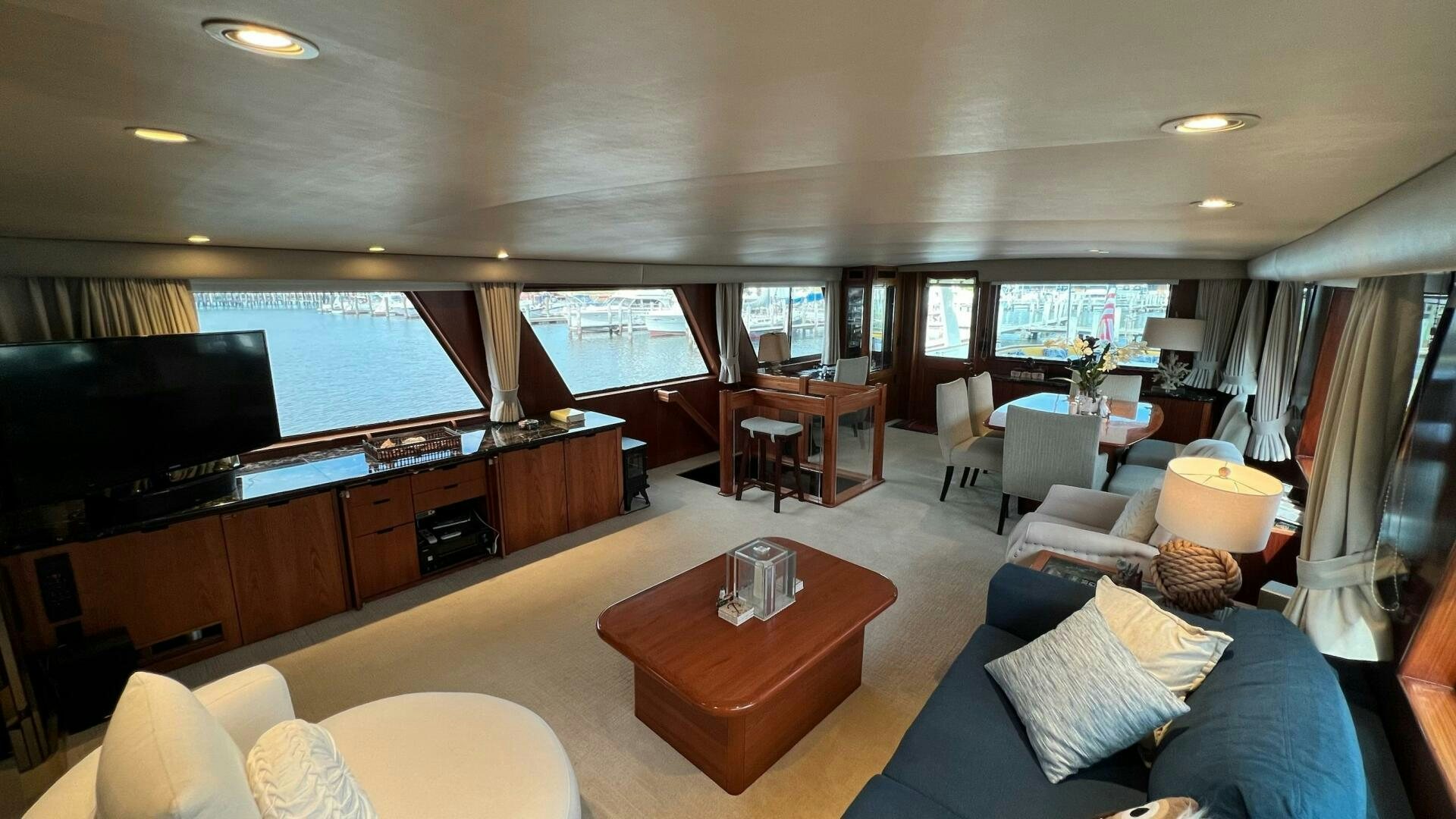 a living room with a large window aboard SEA OWL Yacht for Sale