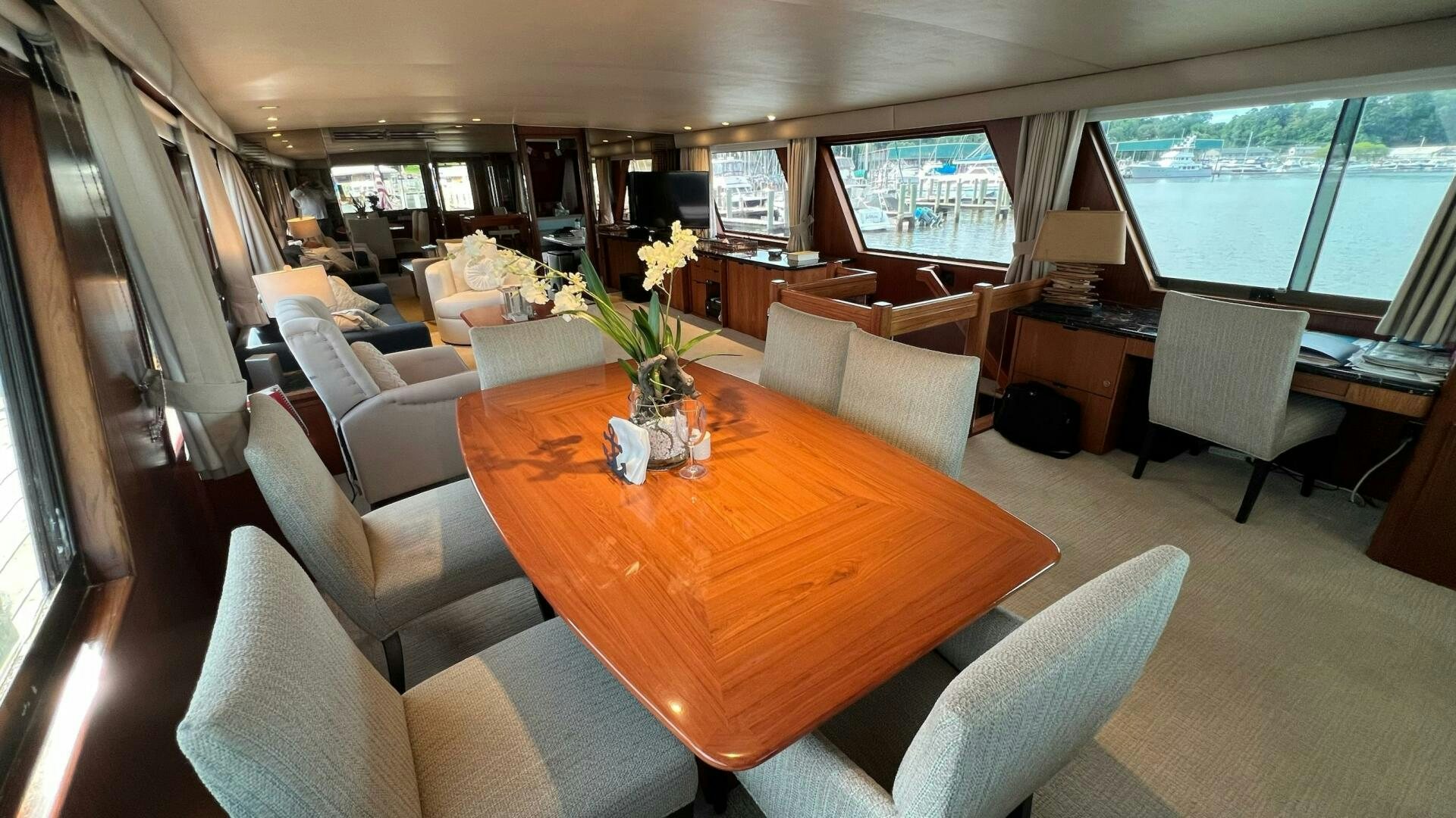 a dining room with a table and chairs aboard SEA OWL Yacht for Sale