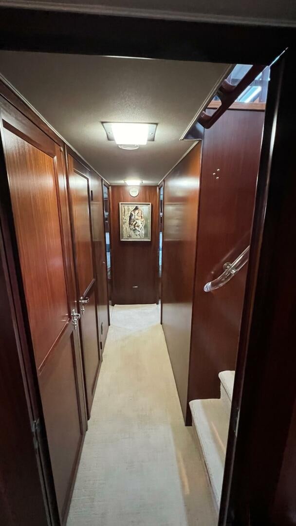a hallway with wood doors aboard SEA OWL Yacht for Sale