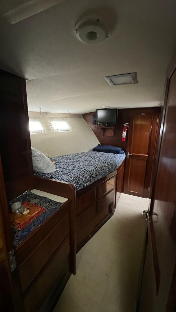 a small bedroom with a bed aboard SEA OWL Yacht for Sale