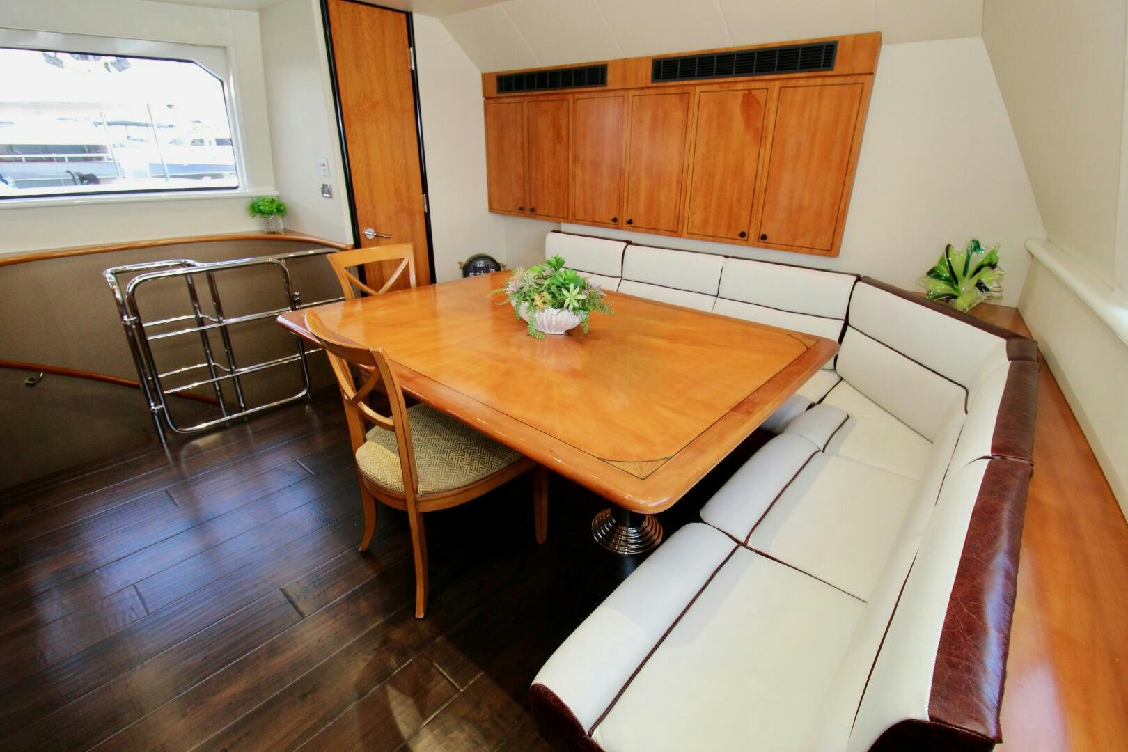 a kitchen with a table and chairs aboard MY WAY Yacht for Sale
