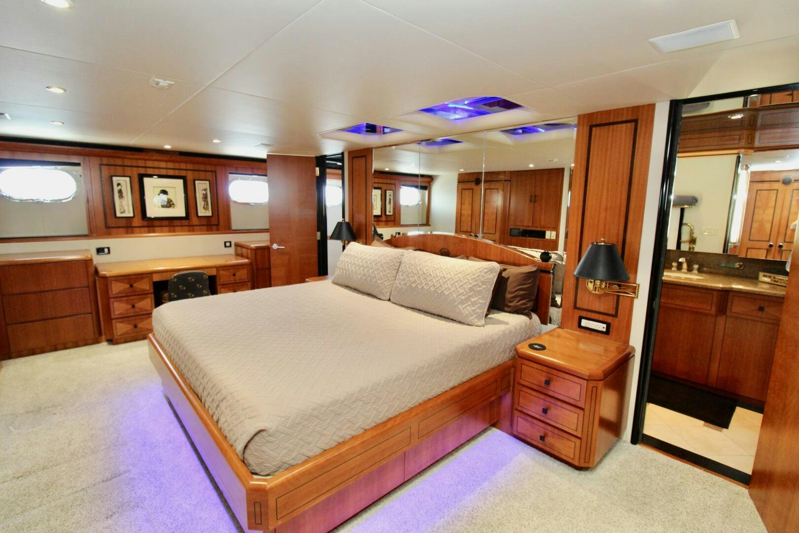 a bedroom with a bed and a desk aboard MY WAY Yacht for Sale