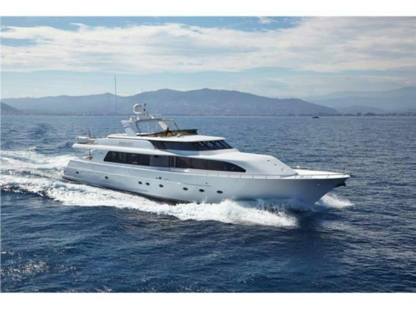 a white yacht in the water aboard INTEGRITY Yacht for Sale