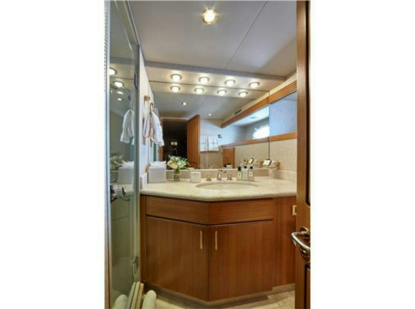 a bathroom with a sink and a mirror aboard INTEGRITY Yacht for Sale