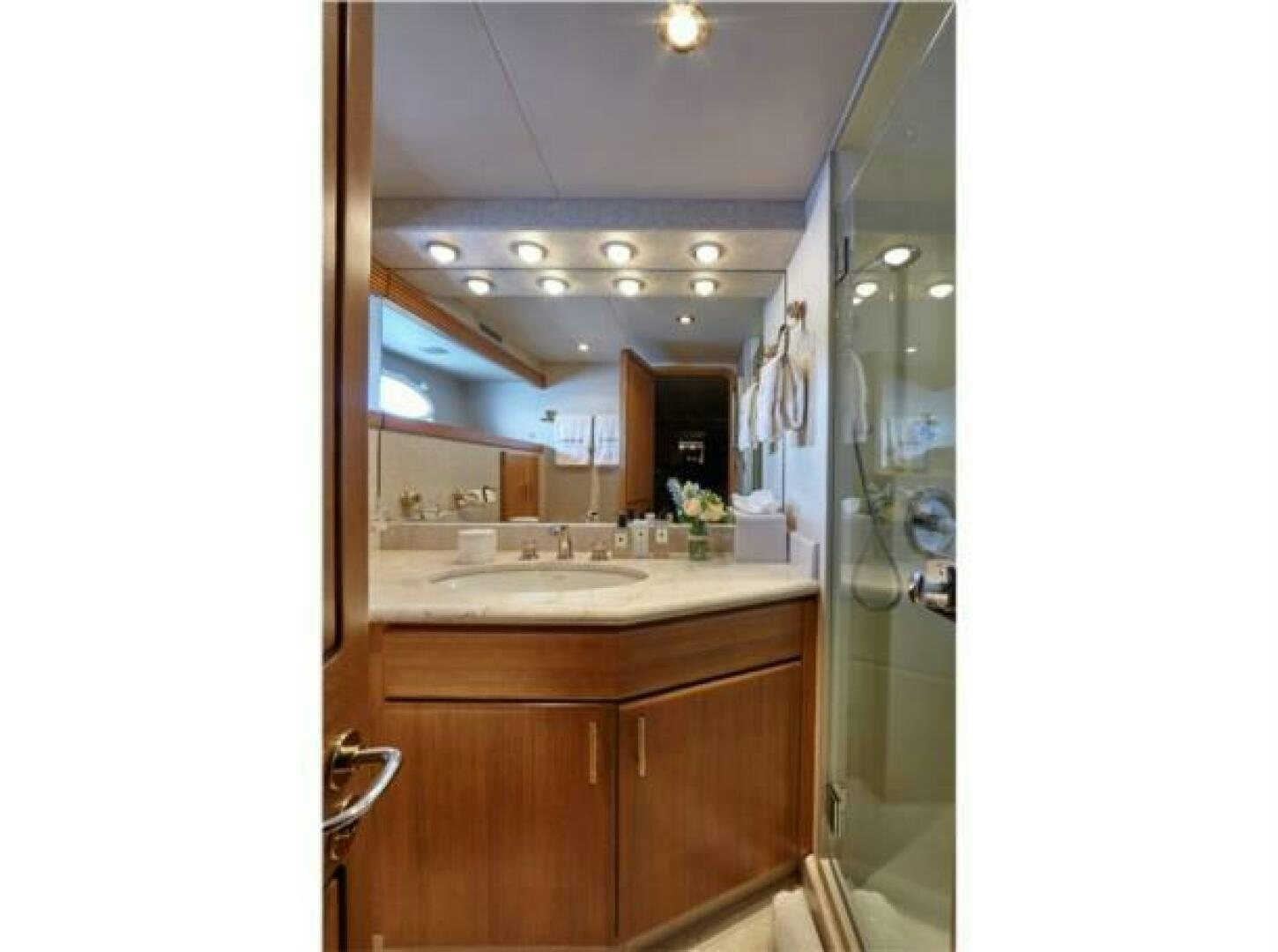 a bathroom with a sink and a mirror aboard INTEGRITY Yacht for Sale