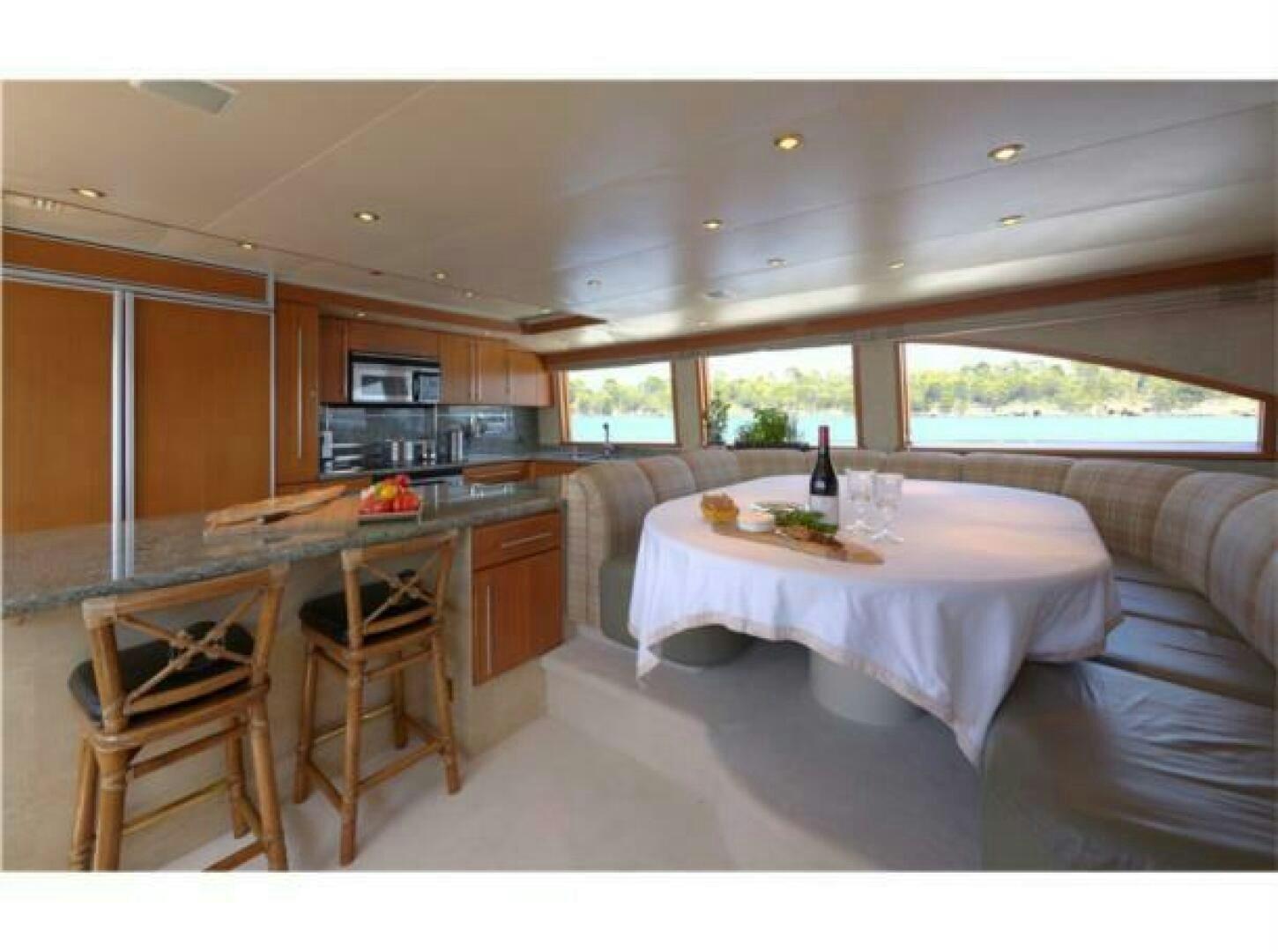 a kitchen with a table and chairs aboard INTEGRITY Yacht for Sale