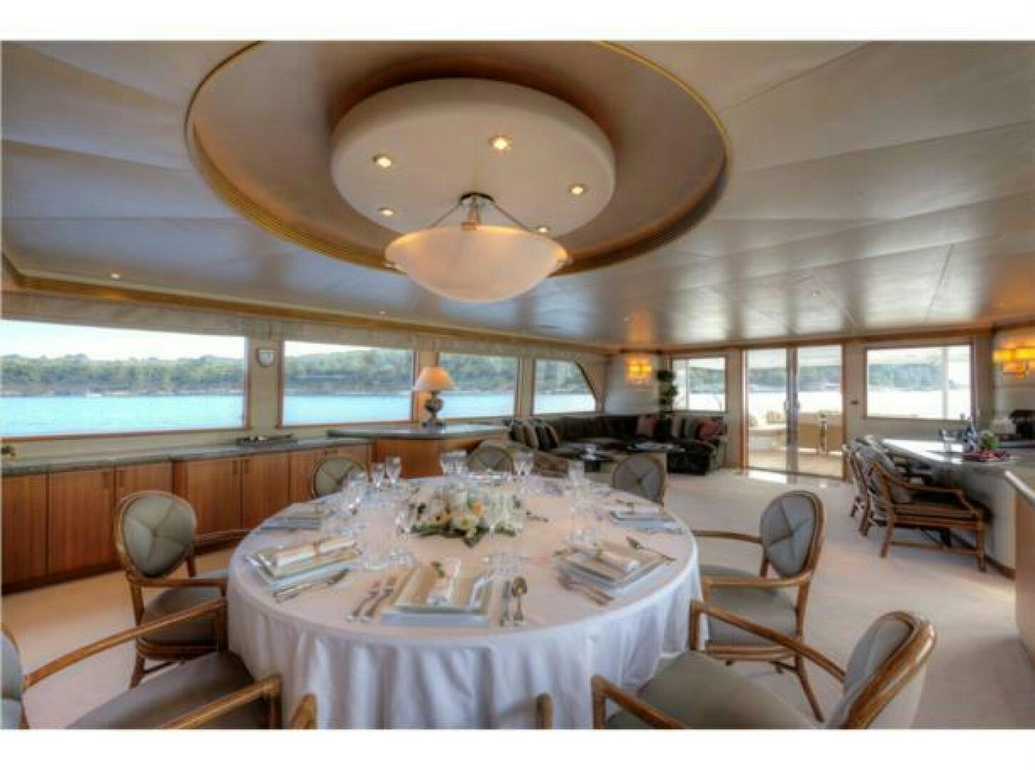 a dining room with a large table aboard INTEGRITY Yacht for Sale