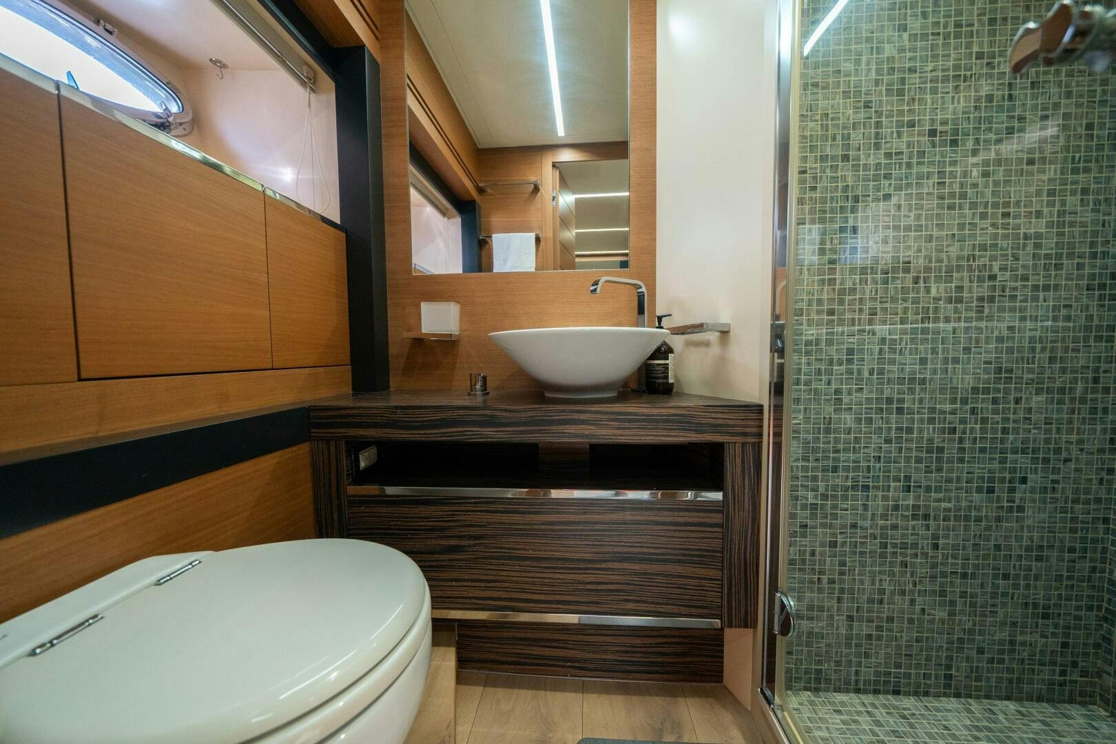 a bathroom with a sink and a toilet aboard INCOGNITO Yacht for Sale