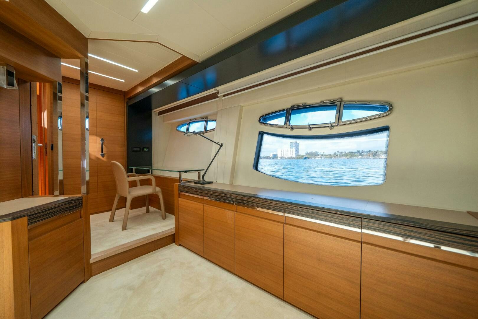 a room with a large window and a large white object in the middle aboard INCOGNITO Yacht for Sale
