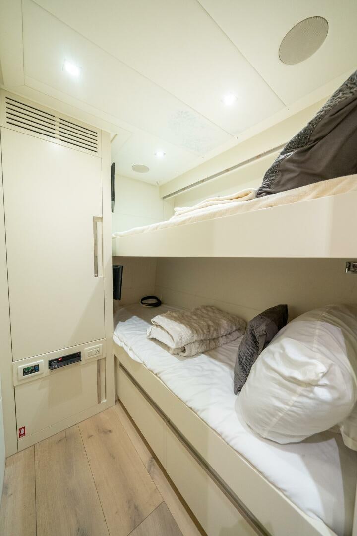 a room with a bed and a closet aboard INCOGNITO Yacht for Sale