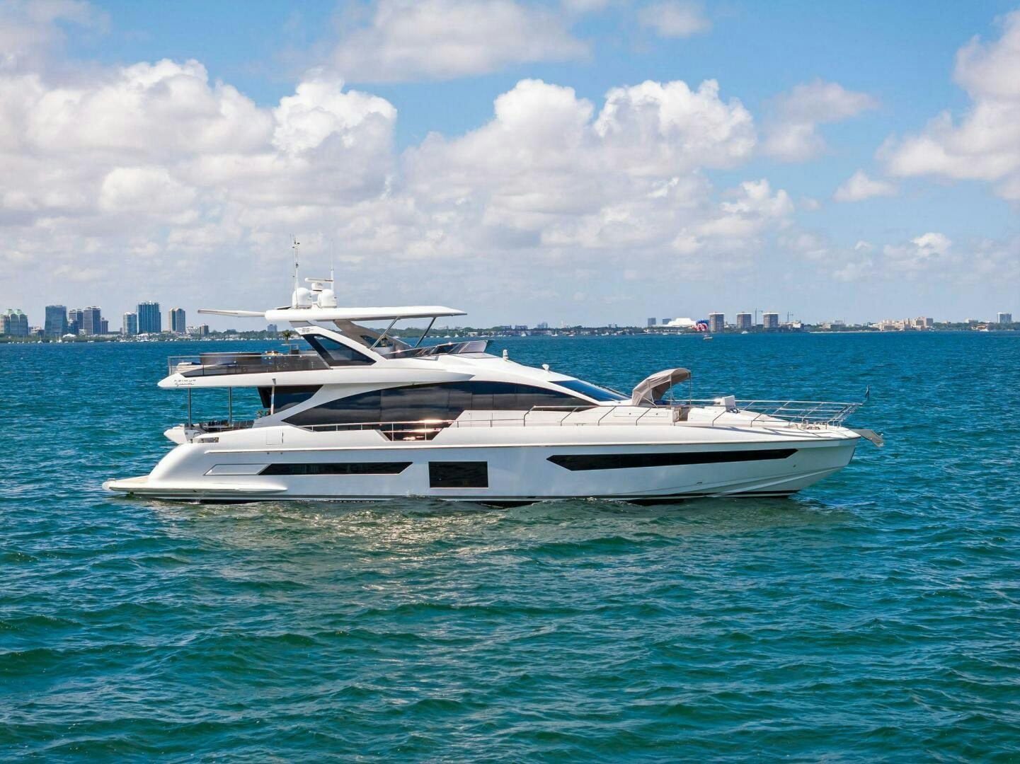 a white yacht in the water aboard LIMITLESS Yacht for Sale
