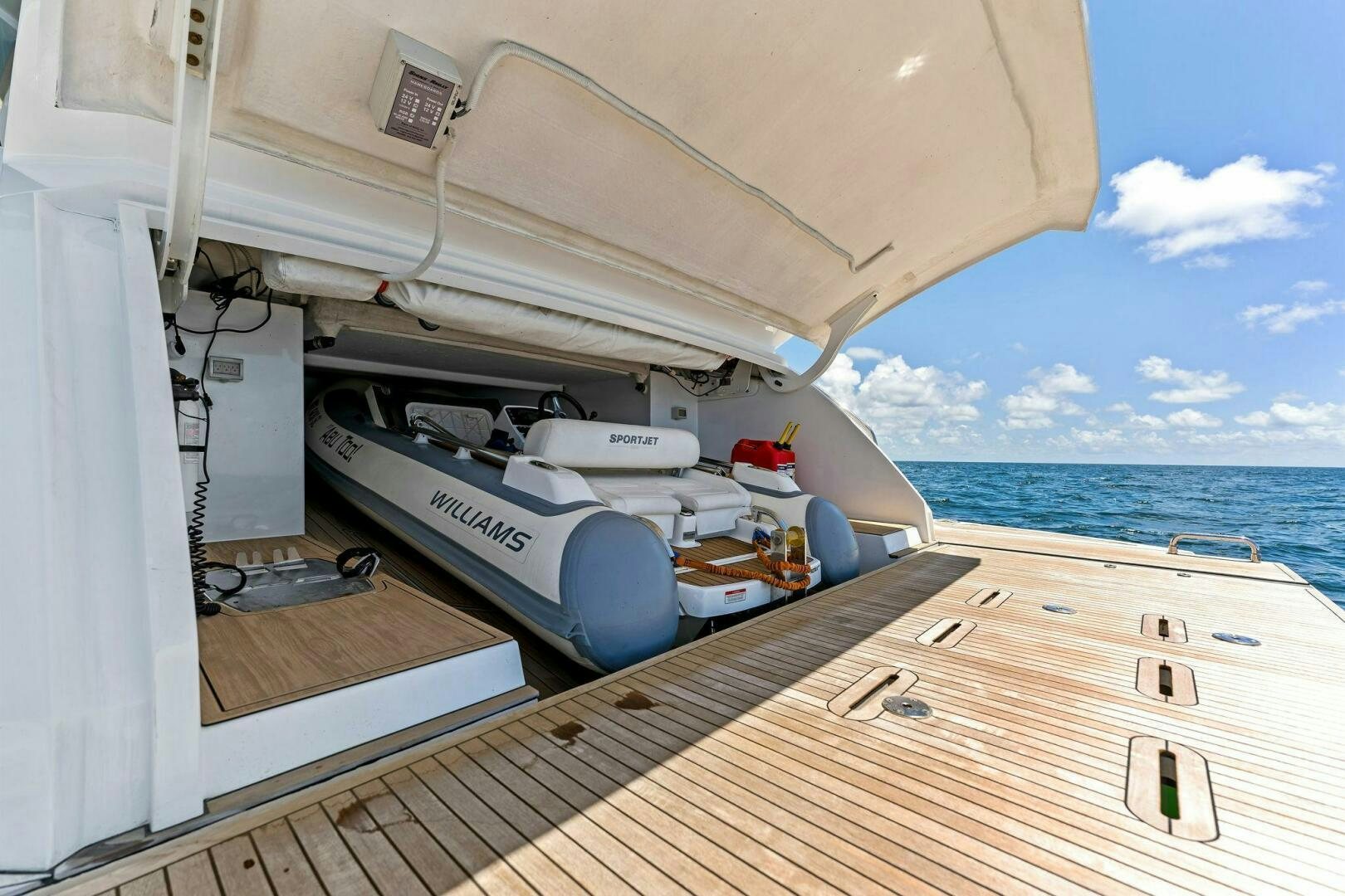 a boat on a deck aboard LIMITLESS Yacht for Sale