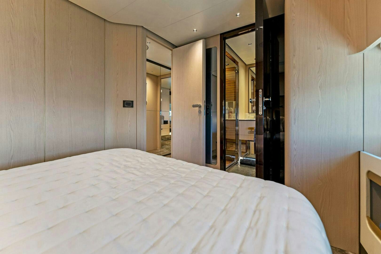 a bed in a room aboard LIMITLESS Yacht for Sale