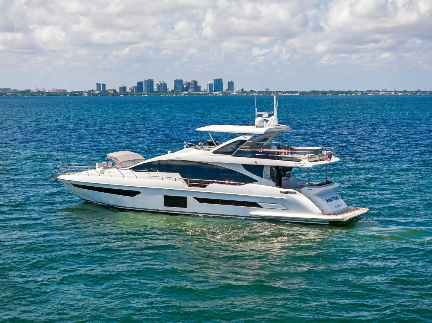 a white yacht in the water aboard LIMITLESS Yacht for Sale