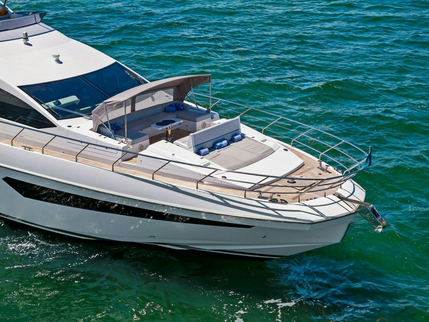 a white boat in the water aboard LIMITLESS Yacht for Sale